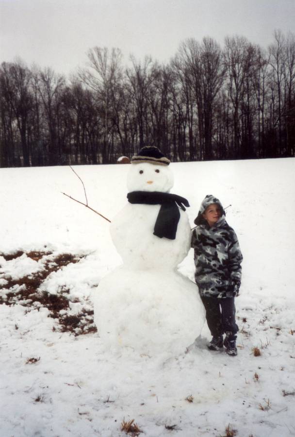 Andrew with the snowman Anna and I built