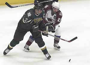 Peter Forsberg blocks Derian Hatcher. (2002-10-10 vs Dallas a tie 1 -1), credit: Mark Leffingwell. http://www.bouldernews.com/bdc/avalanche/