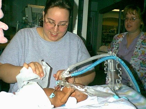 Christie gives Jessyka a bath Apr 23 '02