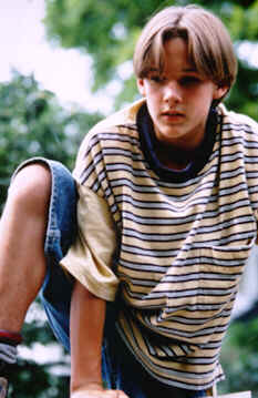 Erik climbs over the fence to Dexter's house