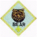 Bear - The Bear rank is for boys who have completed second grade (or are age 9). There are twenty-four Bear achievements in four different categories. The Cub Scout must complete twelve of these to earn the Bear badge. These requirements are somewhat more difficult and challenging than those for Wolf rank.