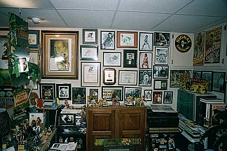 13. Autographed movie stills on the side of Mike's desk.