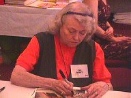 Eve Brent signing autographs for fans