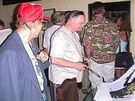 Huck Huckenpohler watching Laurence Dunn touch up pre-production art