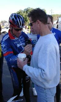Lance signs Mike's shirt.