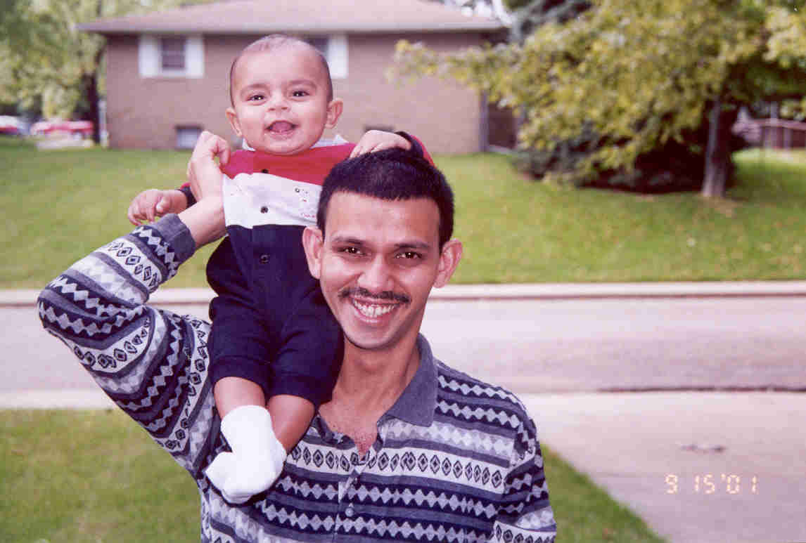 Gundu on Appa's shoulder