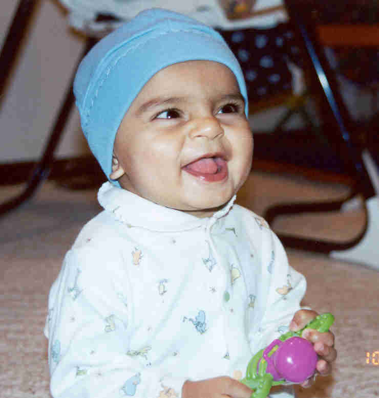 Gundu playing with teether