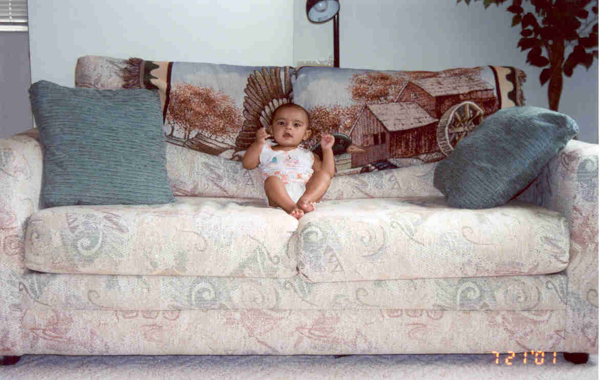 Gundu sitting in Sofa watching TV