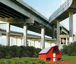 The Mexi-Canadian Overpass looms over a barn in Pawhuska, OK