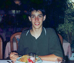 Jim enjoys his spaghetti at an Italian restaurant.