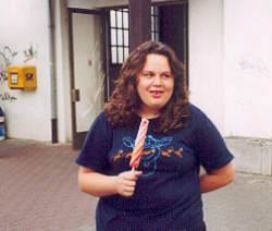 Kristen tries her popsicle outside the train station.