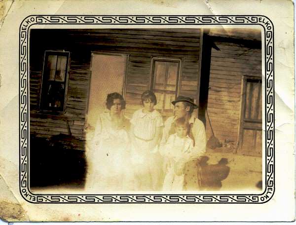 Ed and Marie Messinger, Agnes (standing) Norma (on Marie's lap) and Ira (standing in front of Ed.