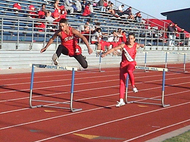 Zach and Adrian hurdling down the track