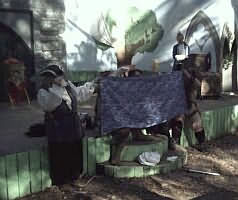 A puppet show with bob hobgoblin behind the blanket.