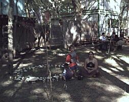 A beautiful fairy mother sitting beside her sons.