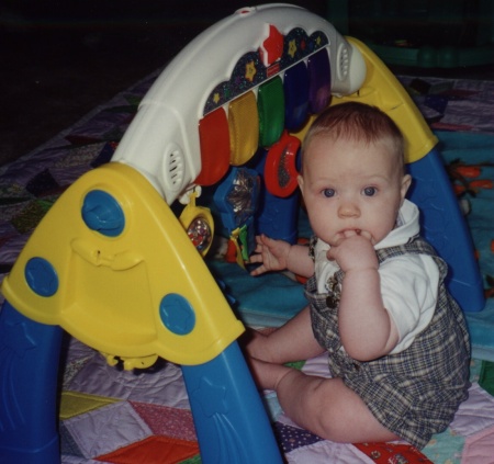 Jason playing with a toy on the floor--7 months old