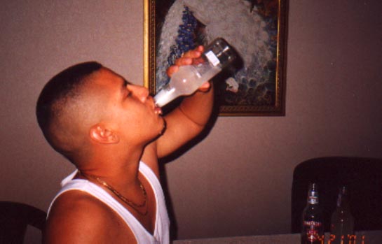 Santos chugging a Smirnoff after Prom