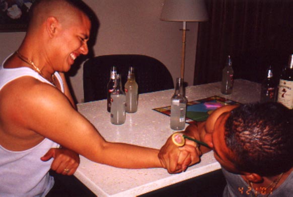 CoCo beating Santos in arm wrestling