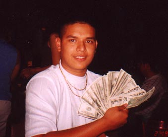 Santos holding up his Graduation Money ($645) @ his Comida