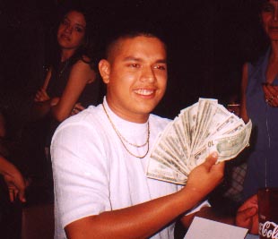 Santos holding up his Money