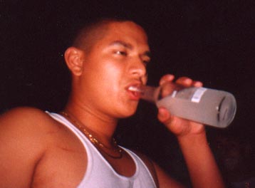 Santos at his house drinking a Smirnoff on June 3, 2001 @ 2:00AM
