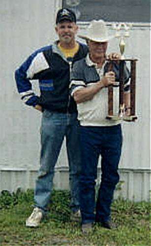 Gene holding a trophy from Red River.