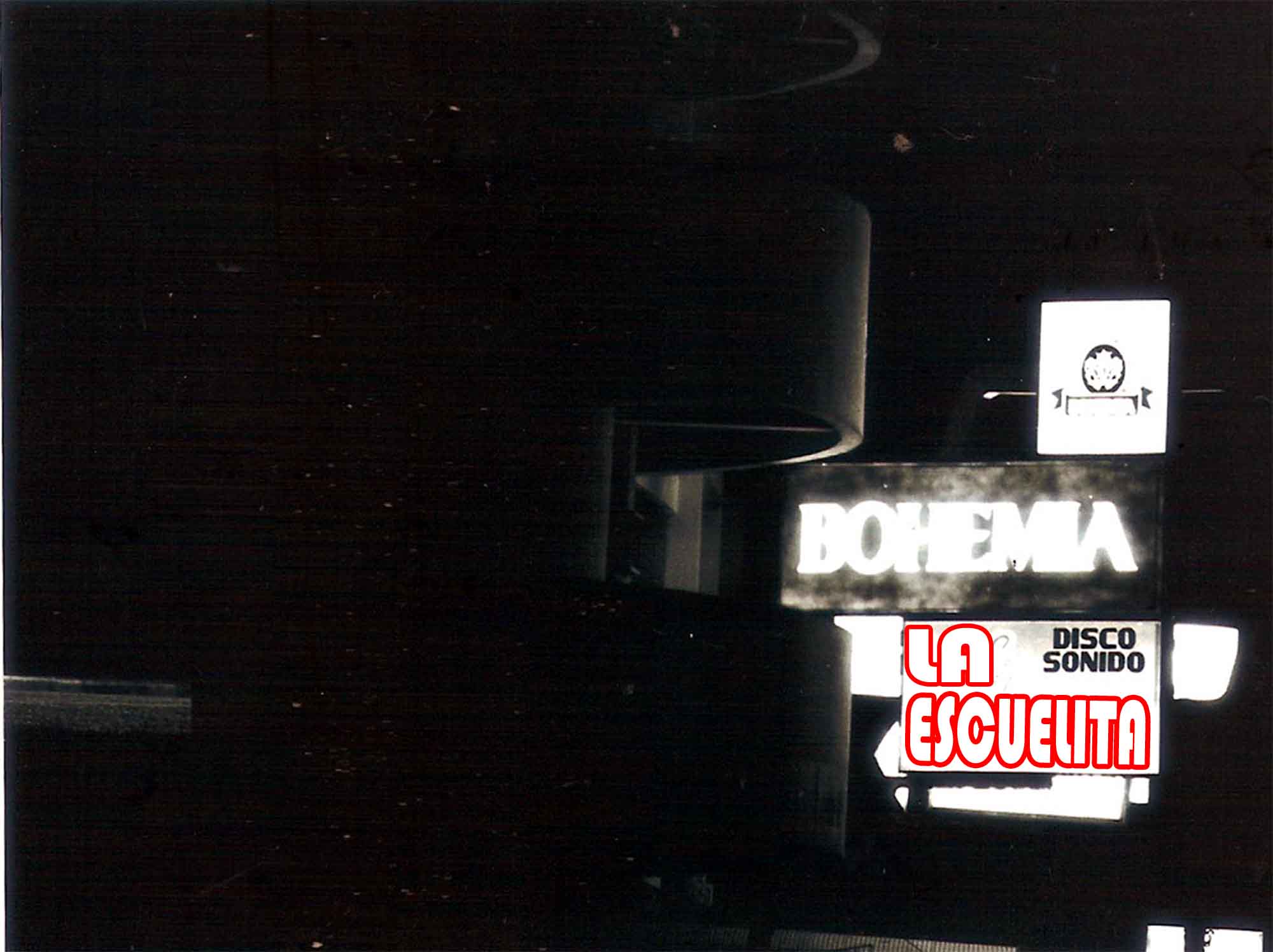 78. Cabareces Urbanos Barrios: La Escuelita- Blanco y Negro- (Nocturna)- Optica 90-230m11Formato: 35-2- 1/4 x 5- 1/2Seal Urbana No.03  Desviese de esos sitios que lo  Pueden conducir a males peoresEsquina RojaTiro largo vertical1984-.