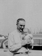 Image: Leonard Viles holding his granddaughter
