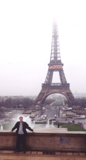 This is me standing by the Eiffel Tower in Paris.