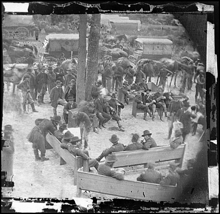 War Conference; General Grant studies map held by General George Meade.