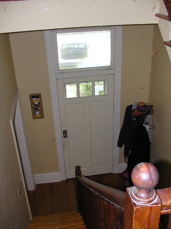 looking down the staircase in the center entrance hall