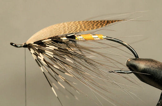 Then take a few raps to lock it down and trim off the excess.