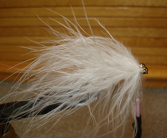 Tie in large silver bead chain. Figure 8 thread until bead chain eyes are secure as head of fly.