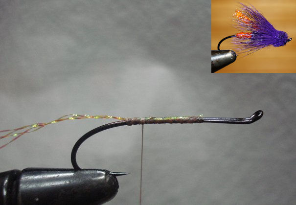 Hook in vise, tie in 4 strands of Krystal Flash, wrap forward for tag.