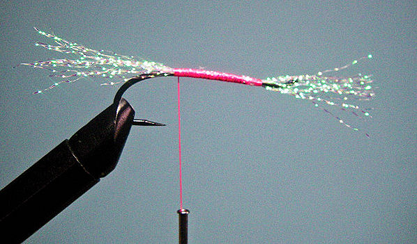 3. To make it easier to work with the dubbing on the body I cut the Flash strands at about a body length in front of the eye so that when pulled to the rear they will surround the body and reach the start of the tail.