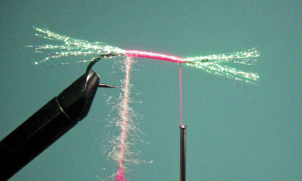 5. Twist the loop to make the body as tight as you desire and wind the dubbed body forward.