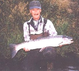 Gail McDougall of Blue Mountain Anglers and Fly Shop with one of his 1999 catches on the lower Deschutes River.