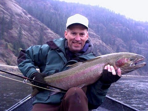 A client  savors the rewards of fly fishing the Clearwater with expert guide, Jeff Jarrett of Jarrett's Guide Service,  Orofino, Idaho.