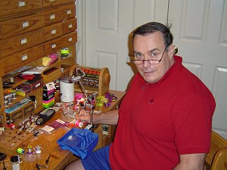 Dr. John Glaspy at his fly tying desk.