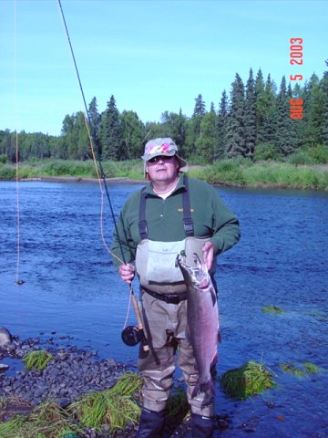 Contributing Fly Tyer, John Glaspy, displays the successfull results of casting one of his Pacific Salmon Speys. This nice Silver was caught on his annual trip to Alaska in August.