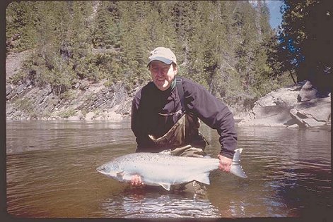Charlie Dickson about to release a beautiful 40 inch Atlantic Salmon he caught on the Dartmouth river in Qu&eacute;bec in the spring of 2001