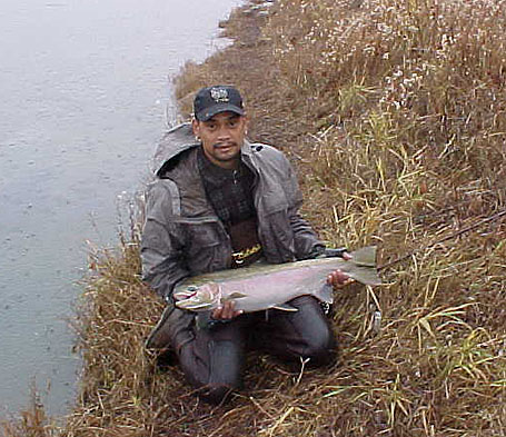 Erwin, holding with a bright 38 inch Steelhead landed in Mid-December on Oregon's  John Day River. Erwin hooked this beauty on a Purple Egg-Sucking Leech
