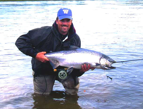 John Garret, of Garrett's Guide Service in Carson, WA, displays a beautiful Chinook caught on a fly on the Nushagak River in Alaska on his 7 weight fly rod!