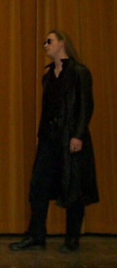 John on Stage with his long leather jacket and shades