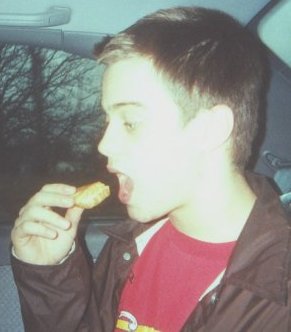 This is a picture of Ruudboy eating a cheese sandwich.