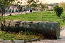 Turkish cannon lying in a park.