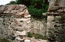 Looking through a crenel into the moat, note the corn crop