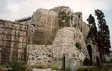 To the left of inside of the Golden Gate is a large talus