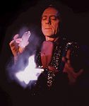 A book of matches bursts into flames as Andre appears to harness the power of a large quartz crystal. This is one of a series of effects presented on Miracles or Deception, a video which challenges the claims of the New Age Movement.