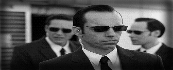 Hugo Weaving and his scary crew of 'Agents', machines in human form.